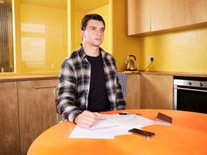UK household reviewing mortgage and moving paperwork at a kitchen table
