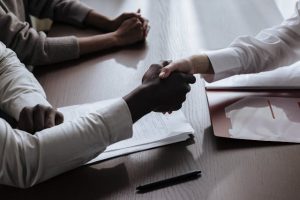 An employment contract being reviewed and signed